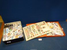 A stamp album titled 'The Victory' containing foreign and British stamps,