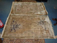 Two Chinese silk rugs of similar design, 3' x 5'.
