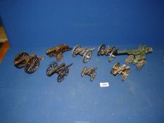 Eight various metal Military canons for display.
