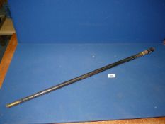 A Sword stick in ebonised wood sheath with inlaid detail to the handle and mask head to the end,