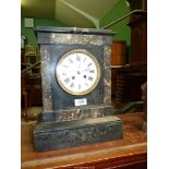 A 1909 Marble Mantle clock having Roman numerals, 14 1/4'' high x 11'' wide x 6 1/4'' deep,