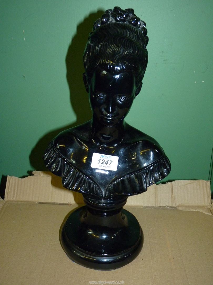 A chalk bust of Queen Anne having a glossy black finish, 14 1/2" tall.