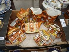 A quantity of cottage ware teapots and jugs and a gravy boat by Price Kensington.