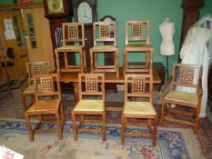 A good set of eight Robert Thompson "Mouseman" Oak lattice-back Dining Chairs including a pair of
