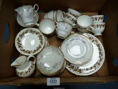 A Royal Stafford part tea set including; 6 cups, 5 saucers, 6 plates, a milk jug and sugar bowl.