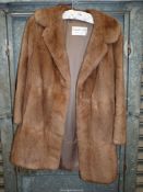 A Maxwell Croft fur jacket, light brown, size Medium.