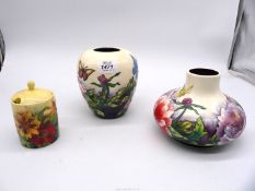 Three pieces of 'Old Tupton ware' consisting of two vases both decorated with butterflies and