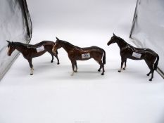 Three china horses including; two Bay Beswick (one a/f - legs broken) and a Royal Doulton Bay horse.
