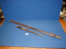 A Military Bayonet dated 1903, marked Sanderson, Sheffield, in a leather and metal sheath,