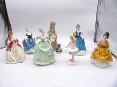 Seven porcelain figures including; Nao girl with puppy, Royal Doulton 'Hilary', 'First Dance',