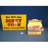 A 'Dinky Toys' perspex retail Sign, 15 1/2" x 10" and a cardboard 'Meccano' display sign.