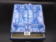 A pair of Waterford crystal candlesticks in original box.