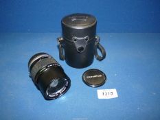 An Olympus OM-System 135mm f/3.5 E.Zuiko Auto-T Lens with lens cap, back cap and original case.
