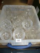 A large quantity of glass including four rose vases and glass trinket bowls and a quantity of