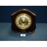 A Smiths Westminster chiming Bakelite clock with pendulum and key.