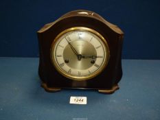 A Smiths Westminster chiming Bakelite clock with pendulum and key.