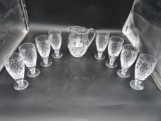 Eight Webbs stemmed lemonade glasses plus a water jug in a similar pattern.