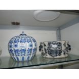 An Oriental blue & white pumpkin shaped vase with non matching lid together with an Oriental