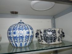 An Oriental blue & white pumpkin shaped vase with non matching lid together with an Oriental