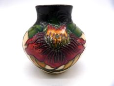 A small Moorcroft ''Anna Lily'' pattern vase 3 1/2" tall.