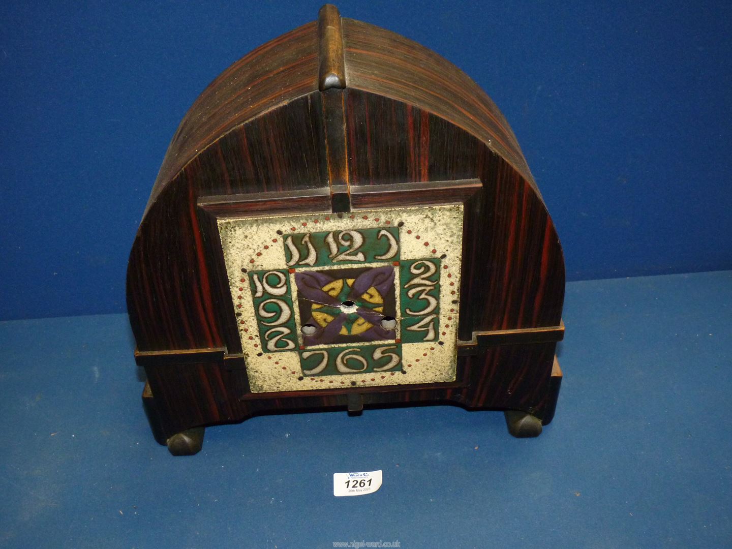 An arts and crafts Rosewood cased Mantel Clock with Mackintosh tiled style face,