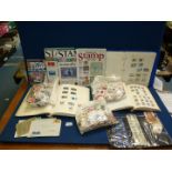 A large quantity of loose foreign stamps, three albums of stamps and three stamp magazines.