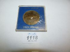 A bronze medallion commemorating H.M.