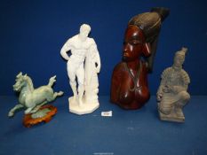 Four miscellaneous figures including; ethnic carved wooden bust of a woman,