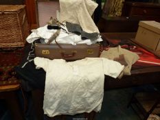 A suitcase and contents of shirts, dress shirts by R.