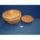 A 1930's woven grass sewing basket with lid, original crepe lining and a similar bowl.