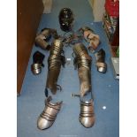 A part set of re-enactment Armour including helmet, gauntlets, leg covers, etc.