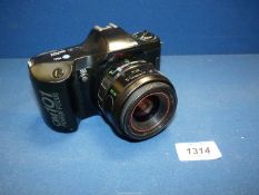 An Olympus OM101 35mm power focus SLR Camera with Olympus 35-70mm f/3.5-4.5 Zoom Lens.