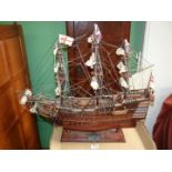 A wooden model of H.M.S Victory on wooden stand, 26 1/2'' long x 22 1/4'' high.