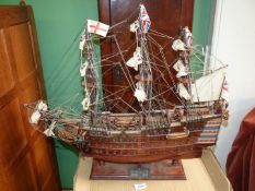 A wooden model of H.M.S Victory on wooden stand, 26 1/2'' long x 22 1/4'' high.