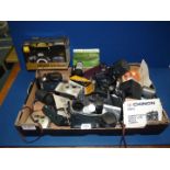 A box of cameras including Ricoh and Olympus, lenses, flashes, etc.