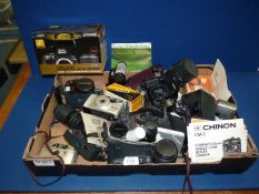 A box of cameras including Ricoh and Olympus, lenses, flashes, etc.