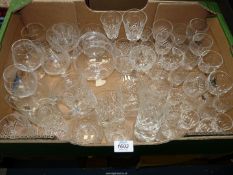 A large quantity of glasses including wine, sherry, brandy and whisky and a few shot glasses etc.