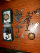 A distressed watch box containing parts of a Moeris watch, another incomplete watch,