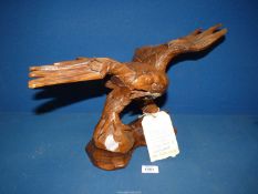 A carved hardwood sculpture of an Eagle, very well executed, possibly from Black Forest Craftsmen,
