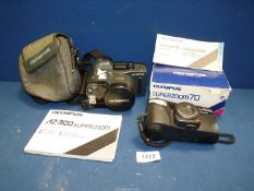An Olympus AZ-300 Superzoom 35mm Compact Camera with instructions together with an Olympus