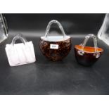 Three Laguna glass handbags from the 'Handbag Collection'.