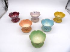 A set of six Beswick lustreware floral petal dessert bowls in various colours.