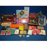 A quantity of playing cards, darts, dice, marbling kit, pen set, pens, Dominoes, marbles, etc.