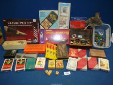 A quantity of playing cards, darts, dice, marbling kit, pen set, pens, Dominoes, marbles, etc.