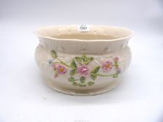 A Belleek 1999 Annual Limited Edition McBirney centrepiece encrusted with pink flowers,