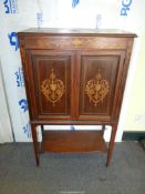 A Rosewood Side Cabinet with Boxwood stringing and elaborate marquetry decoration depicting urns