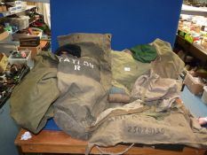 Two large boxes of army issue webbing, rucksacks, kit bags, etc.