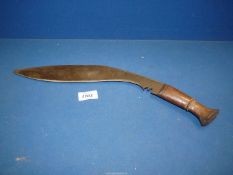 A curved knife with wooden handle.