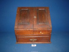 A mahogany Desk Tidy with two doors opening to reveal letter rack and lower drawer,