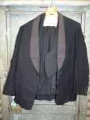 A dinner suit, 42'' chest jacket, 38'' waistcoat, trousers 32'' waist x 29'' leg.